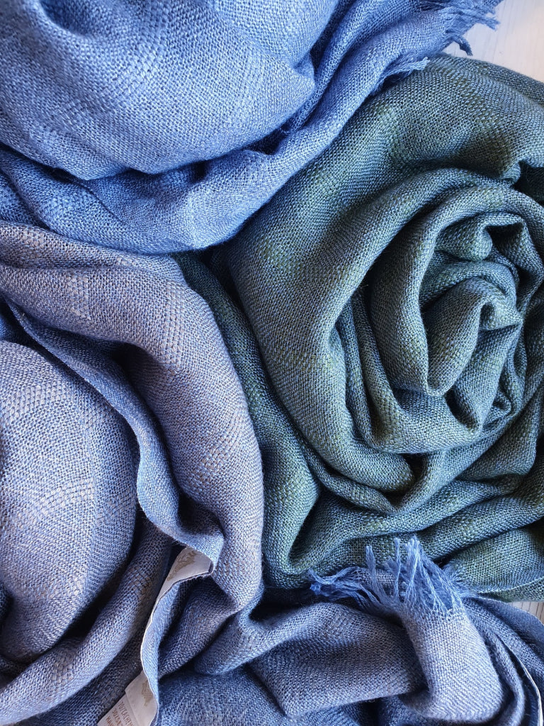 Four versions of Blue, starting from the top, clockwise: Blue woven with Blue, Blue woven with Green, Blue woven with Grey, Blue woven with Brown